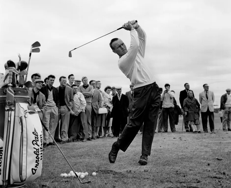 Arnold Palmer completes a golf swing during the 1961 British Open at Royal Birkdale